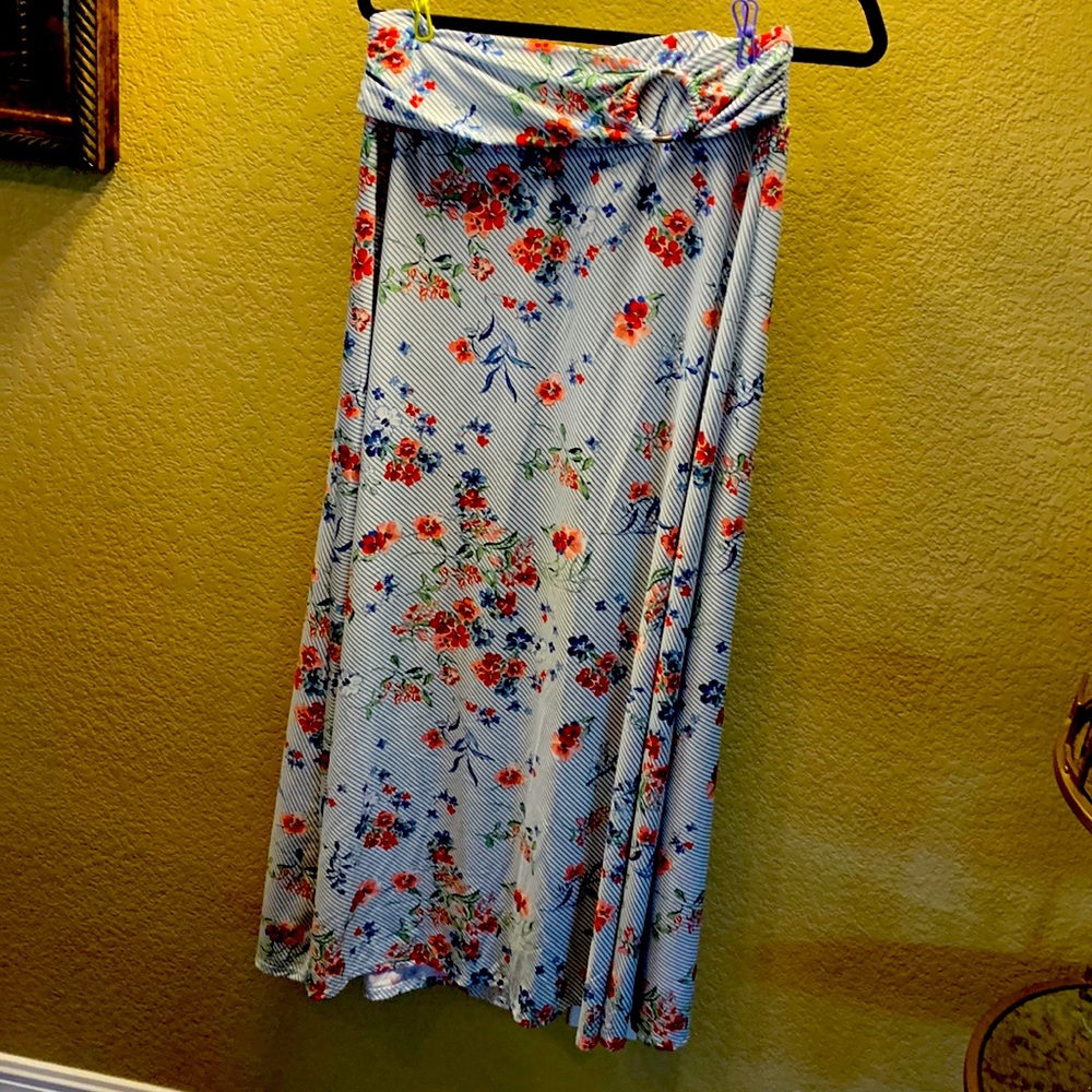 Long skirt with attached belt at waist band.